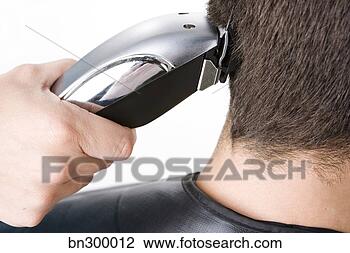 Stock Photo - clippers cutting 
man's hair. fotosearch 
- search stock 
photos, pictures, 
images, and photo 
clipart