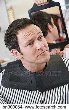 Stock Photo - man looking at 
haircut in mirror. 
fotosearch - search 
stock photos, 
pictures, images, 
and photo clipart