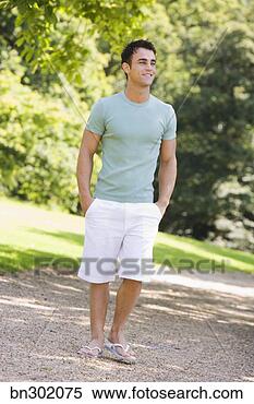 Stock Image - smiling man with 
hands in pockets. 
fotosearch - search 
stock photos, 
pictures, images, 
and photo clipart