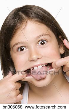Stock Photo - girl with silly 
expression. fotosearch 
- search stock 
photos, pictures, 
images, and photo 
clipart