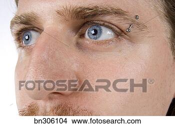 Stock Photo - man with eyebrow 
piercing. fotosearch 
- search stock 
photos, pictures, 
images, and photo 
clipart