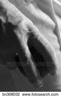 Stock Photo - person holding 
baseball. fotosearch 
- search stock 
photos, pictures, 
images, and photo 
clipart