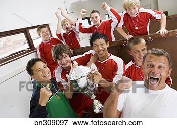 Picture - boys soccer team 
cheering with 
trophy. fotosearch 
- search stock 
photos, pictures, 
images, and photo 
clipart