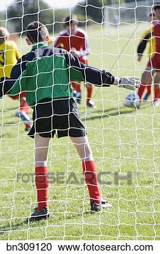 Stock Photography - goalie guarding 
soccer goal. fotosearch 
- search stock 
photos, pictures, 
images, and photo 
clipart