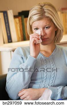 Stock Photograph - crying woman with 
tissues. fotosearch 
- search stock 
photos, pictures, 
images, and photo 
clipart