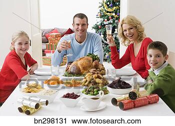 Stock Photography - family at christmas 
dinner. fotosearch 
- search stock 
photos, pictures, 
images, and photo 
clipart