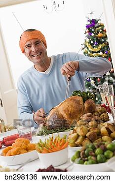 Stock Photo - man carving turkey. 
fotosearch - search 
stock photos, 
pictures, images, 
and photo clipart