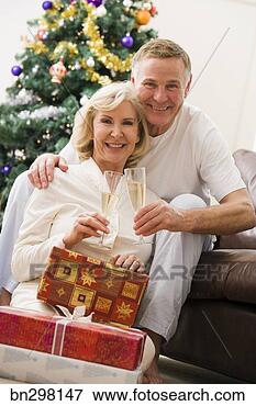 Picture - smiling couple 
with champagne. 
fotosearch - search 
stock photos, 
pictures, images, 
and photo clipart