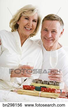 Stock Photo - smiling couple 
with champagne. 
fotosearch - search 
stock photos, 
pictures, images, 
and photo clipart