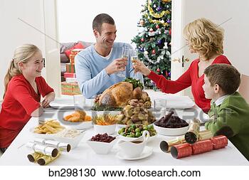 Stock Photography - toasting at christmas 
dinner. fotosearch 
- search stock 
photos, pictures, 
images, and photo 
clipart