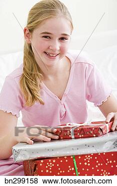 Stock Photo - girl with christmas 
presents. fotosearch 
- search stock 
photos, pictures, 
images, and photo 
clipart