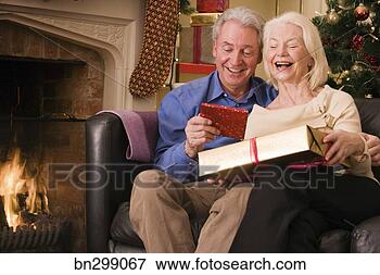 Picture - middle-aged couple 
at christmas. 
fotosearch - search 
stock photos, 
pictures, images, 
and photo clipart