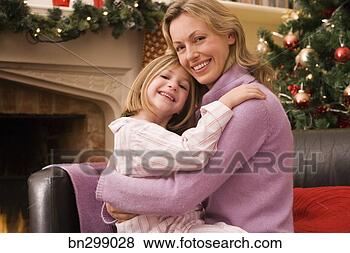 Stock Photo - mother and daughter 
at christmas. 
fotosearch - search 
stock photos, 
pictures, images, 
and photo clipart