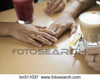 Picture - people holding 
hands by beverages. 
fotosearch - search 
stock photos, 
pictures, images, 
and photo clipart