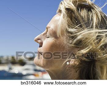 Stock Photo - pensive woman 
with eyes closed. 
fotosearch - search 
stock photos, 
pictures, images, 
and photo clipart
