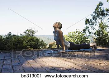 Stock Photography - woman practicing 
yoga. fotosearch 
- search stock 
photos, pictures, 
images, and photo 
clipart