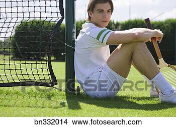 Stock Photo - man sitting on 
tennis court. 
fotosearch - search 
stock photos, 
pictures, images, 
and photo clipart
