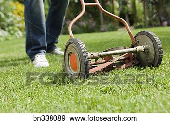 Stock Photograph - old-fashioned 
lawn mower. fotosearch 
- search stock 
photos, pictures, 
images, and photo 
clipart