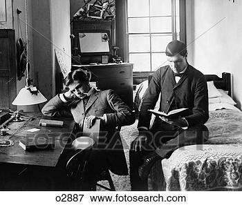 Picture - 1890s pair of 
male students 
studying in dorm 
room. fotosearch 
- search stock 
photos, pictures, 
images, and photo 
clipart