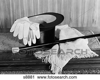 Stock Photography - magician's hat 
gloves and magic 
wand on table 
indoor. fotosearch 
- search stock 
photos, pictures, 
images, and photo 
clipart