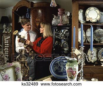 Stock Photograph - man and woman 
in antique shop. 
fotosearch - search 
stock photos, 
pictures, images, 
and photo clipart