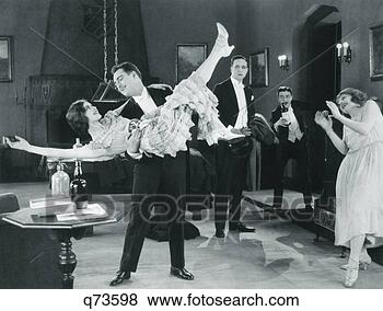 Stock Photo - 1920s movie still 
of wild party 
with woman flapper 
turned upside-down. 
fotosearch - search 
stock photos, 
pictures, images, 
and photo clipart