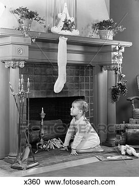 Stock Photography - 1940 1940s little 
girl in pajamas 
kneeling by fireplace 
under. fotosearch 
- search stock 
photos, pictures, 
images, and photo 
clipart