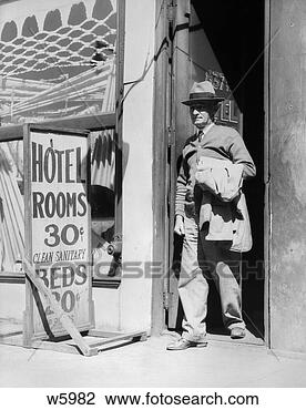 Stock Photo - 1940s elderly 
man walking out 
of door next to 
sign reading hotel. 
fotosearch - search 
stock photos, 
pictures, images, 
and photo clipart