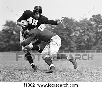 Hazır Fotoğraf - futbol,  oyuncu, 
 yaradiliş,  tackled. 
fotosearch - foto, 
resim, görüntü 
ve foto klipart 
ara