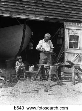 Banco de Imagem - idoso,   avô, 
  trabalhando, 
  serra,   cavalos, 
  pequeno,   menino. 
fotosearch - busca 
de fotos, imagens 
e clipart