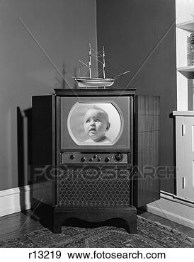 Stock Photograph - 1950s console 
televsion set 
head on baby face 
insert in screen 
model. fotosearch 
- search stock 
photos, pictures, 
images, and photo 
clipart