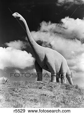 Stock Photograph - 1950s dinosaur 
park south dakota 
statue large brontosaurus 
on hilltop. fotosearch 
- search stock 
photos, pictures, 
images, and photo 
clipart