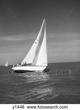 Stock Photo - 1960s group of 
five men sitting 
on large sailboat 
in middle of ocean. 
fotosearch - search 
stock photos, 
pictures, images, 
and photo clipart