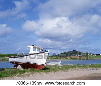 Picture - fishing boat on 
land, havre-aux-maisons, 
quebec, canada. 
fotosearch - search 
stock photos, 
pictures, images, 
and photo clipart