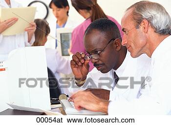 Stock Photo - a head shot of 
an african-american 
male doctor and 
a caucasian male. 
fotosearch - search 
stock photos, 
pictures, images, 
and photo clipart