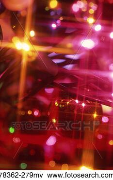 Picture - multicolored lit 
mini christmas 
lights and ornaments. 
fotosearch - search 
stock photos, 
pictures, images, 
and photo clipart