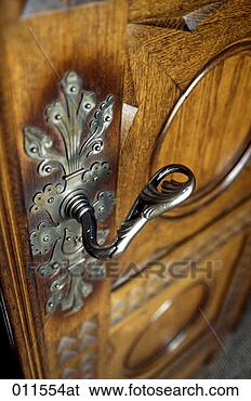 Stock Photo - ornate door handle 
on a wooden castle 
door,  neuschwanstein 
castle. fotosearch 
- search stock 
photos, pictures, 
images, and photo 
clipart
