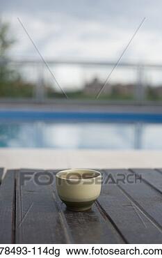 Stock Photo - cup of tea by 
pool. fotosearch 
- search stock 
photos, pictures, 
images, and photo 
clipart