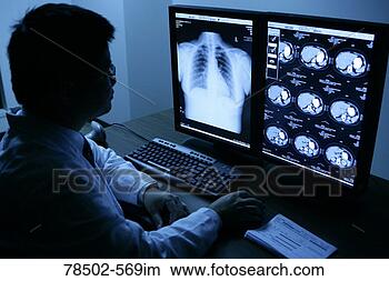Stock Photo - doctor examining 
mri scans. fotosearch 
- search stock 
photos, pictures, 
images, and photo 
clipart