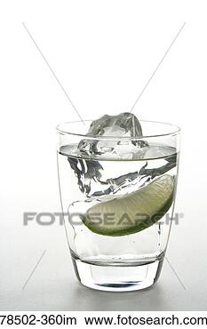 Stock Photo - glass of ice water 
with lemon wedge. 
fotosearch - search 
stock photos, 
pictures, images, 
and photo clipart