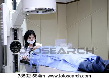 Stock Photo - healthcare professional 
preparing patient 
for radiation 
therapy. fotosearch 
- search stock 
photos, pictures, 
images, and photo 
clipart