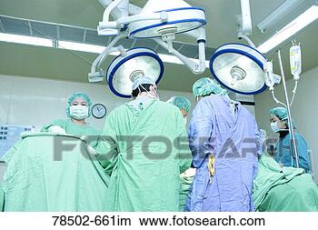 Stock Photo - healthcare professionals 
performing surgery. 
fotosearch - search 
stock photos, 
pictures, images, 
and photo clipart