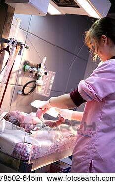 Stock Photo - midwife caring 
for newborn baby. 
fotosearch - search 
stock photos, 
pictures, images, 
and photo clipart