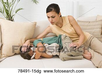Stock Photo - mother feeling 
of son's forehead. 
fotosearch - search 
stock photos, 
pictures, images, 
and photo clipart