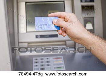 Stock Photo - person holding 
bank card. fotosearch 
- search stock 
photos, pictures, 
images, and photo 
clipart