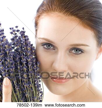 Stock Photo - smiling woman 
holding wildflowers. 
fotosearch - search 
stock photos, 
pictures, images, 
and photo clipart