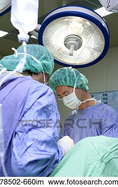 Stock Photo - surgeons performing 
procedure on patient. 
fotosearch - search 
stock photos, 
pictures, images, 
and photo clipart