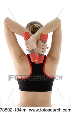 Stock Photo - woman exercising 
with free weights. 
fotosearch - search 
stock photos, 
pictures, images, 
and photo clipart