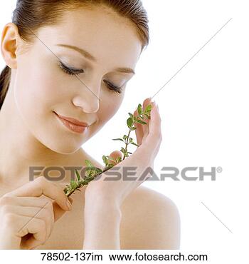 Stock Photo - woman holding 
plant. fotosearch 
- search stock 
photos, pictures, 
images, and photo 
clipart