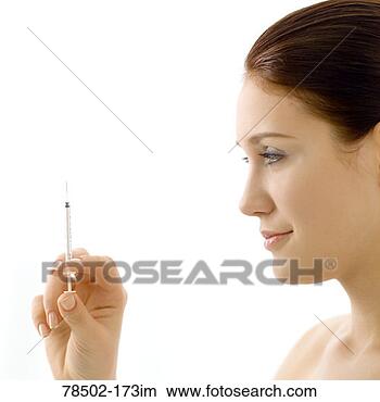 Stock Photo - woman with hypodermic 
needle. fotosearch 
- search stock 
photos, pictures, 
images, and photo 
clipart